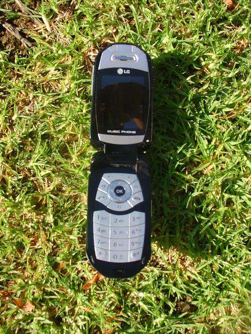LG Music Phone ( working 100% but no back cover and some scratches)