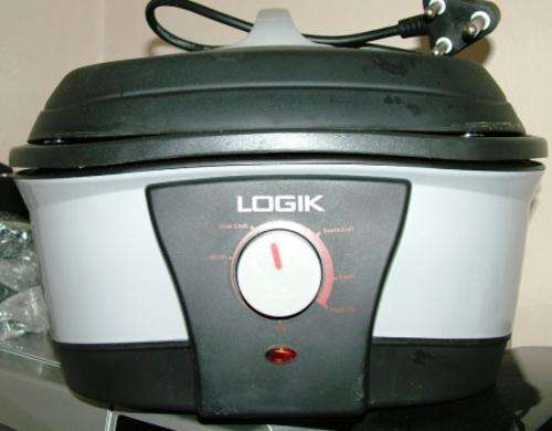 ALL PURPOSE SLOW COOK , GRILL, ROAST, FLASH FRY AND WARMER: USED AS DEMO