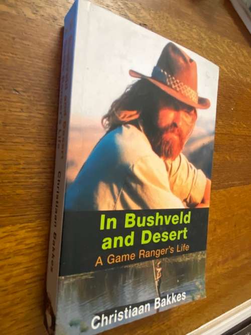 Christiaan Bakkes. In Bushveld and Desert : a game Ranger`s life (signed by author)