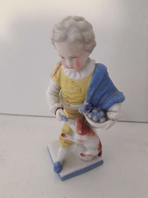 Porcelain Boy and Dog Figurine