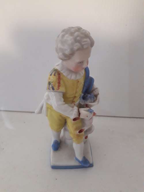Porcelain Boy and Dog Figurine