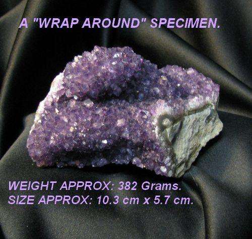 AMETHYST CRYSTAL SPECIMEN FROM PORTION OF A GEODE.