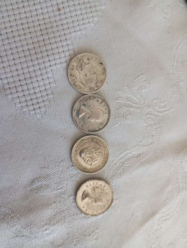 A set of four 6d silver assorted union coins