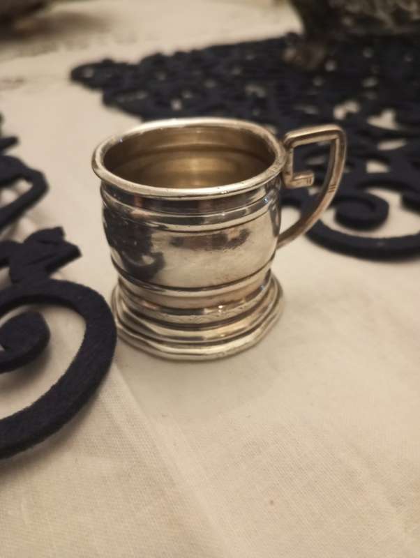 A small South African sterling tot measure