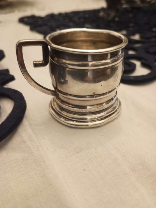A small South African sterling tot measure