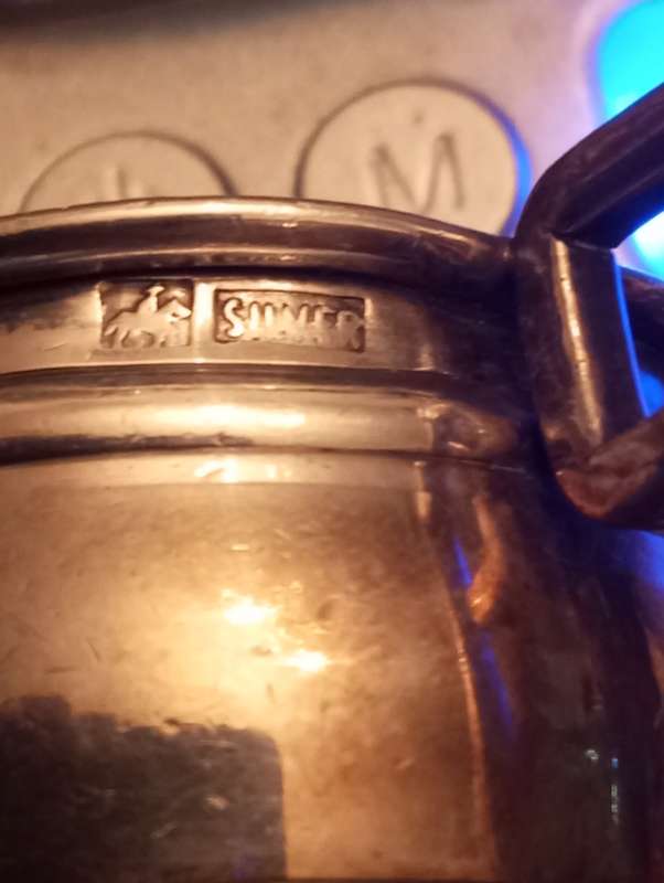 A small South African sterling tot measure