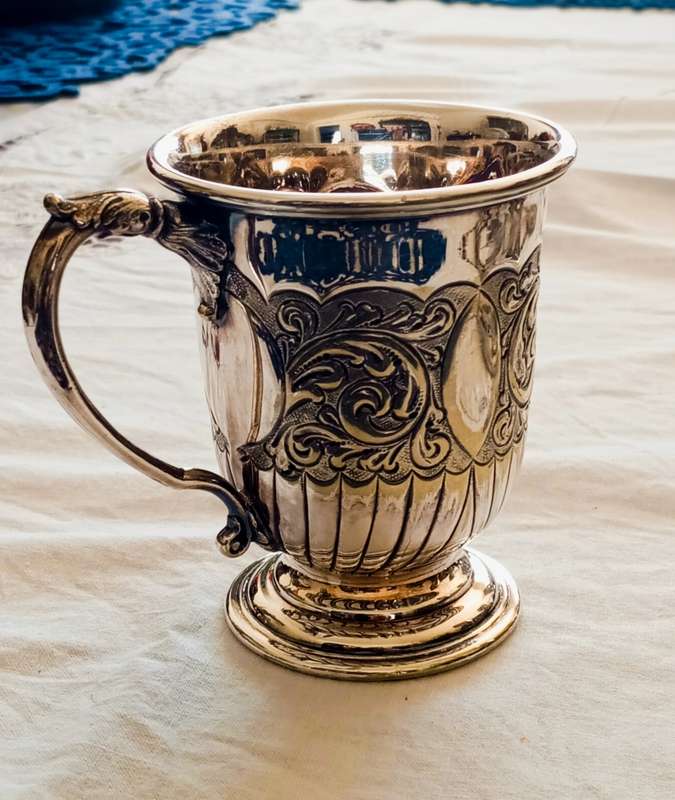 A lovely vintage silver plate christening mug