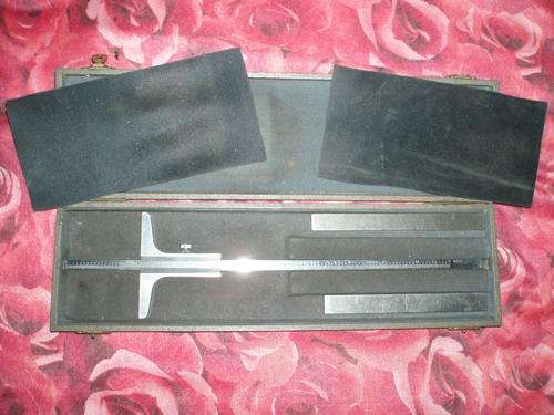 Old fashioned measuring tool in damaged box, 9.5x33cm