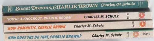 FOUR CHARLIE BROWN PAPERBACKS BY CHARLES M SCHULZ