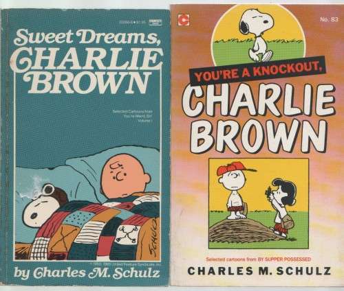 FOUR CHARLIE BROWN PAPERBACKS BY CHARLES M SCHULZ