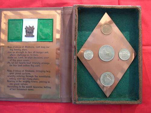 Rhodesian Anthem and coin book with copper, see pictures, condition fair to good
