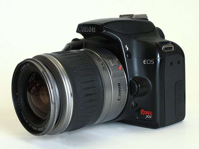 Canon EOS 1000D / Rebel XS, plus lens.