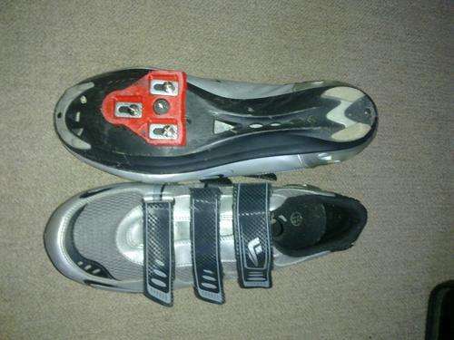 Olympic road shoes with red cleats