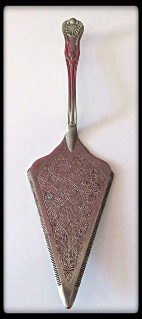 A Silver Metal Diamond-Shaped Cake Serving Spatula- Beautifully Decorated - Lovely Item!