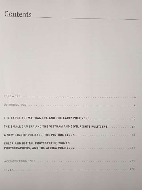 Moments: A Visual Chronicle of Our Time-Revised & Updated by Hal Buell