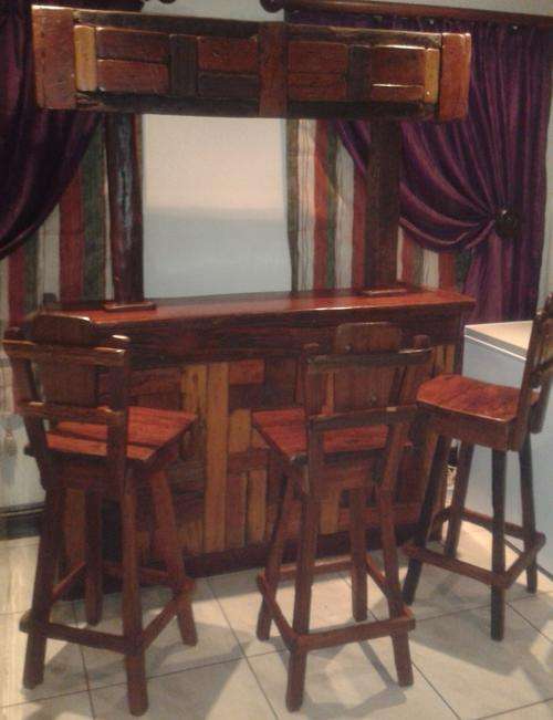 a Solid Sleeper Bar Counter With lots Of Space And 4 X Solid Sleeper Bar Chairs