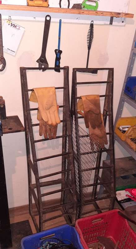 A STORE ROOM FULL OF TOOLS, SHELFS, TABLES, BOLTS, NUTS, SCREWS, SPANNERS ETC