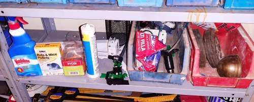 A STORE ROOM FULL OF TOOLS, SHELFS, TABLES, BOLTS, NUTS, SCREWS, SPANNERS ETC