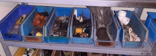 A STORE ROOM FULL OF TOOLS, SHELFS, TABLES, BOLTS, NUTS, SCREWS, SPANNERS ETC