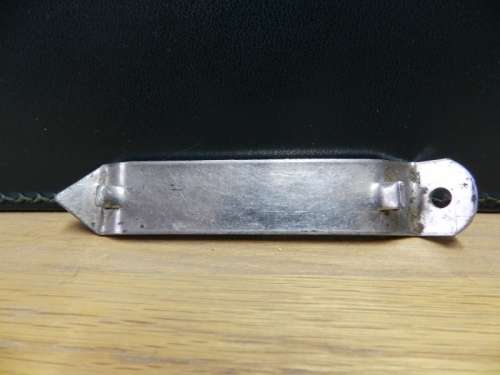 Vintage Bar metal bottle opener marked LION with SAB BADGE.