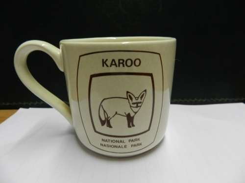Karoo National Park souvenir: Small mug with handle ceramic off white with brown inscription of Bat