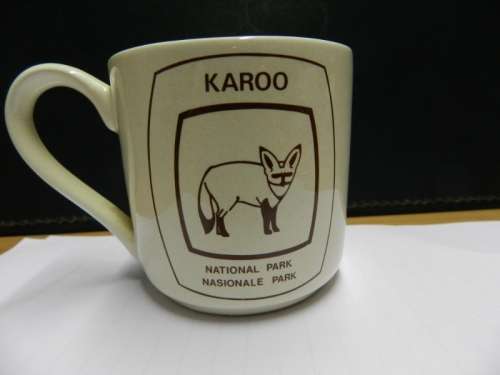 Karoo National Park souvenir: Small mug with handle ceramic off white with brown inscription of Bat