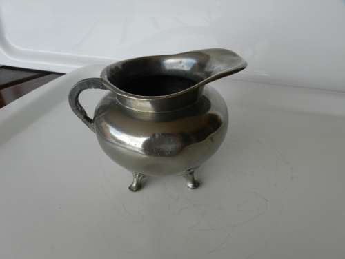 Antique Milk jug. Silver plated with mark reading  giftvrij Tiel Holland