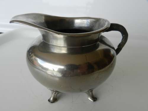 Antique Milk jug. Silver plated with mark reading  giftvrij Tiel Holland