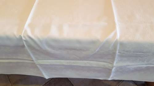 Rectangular White with a hint of yellow Damask Table Cloth, hemmed.