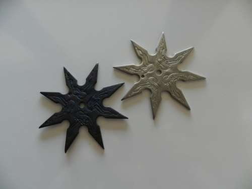 Ninja stars set of two.  Circa 1980s. Eight point Ninja throwing star in solid steel.