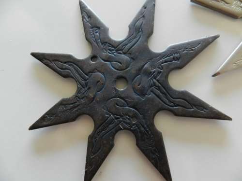 Ninja stars set of two.  Circa 1980s. Eight point Ninja throwing star in solid steel.