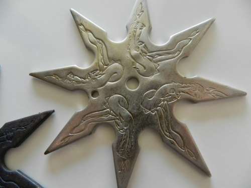Ninja stars set of two.  Circa 1980s. Eight point Ninja throwing star in solid steel.