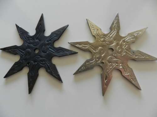 Ninja stars set of two.  Circa 1980s. Eight point Ninja throwing star in solid steel.