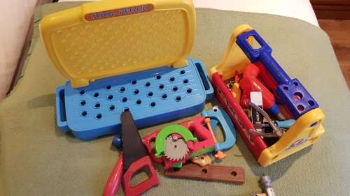 Kids Toy Tool bench in two parts with a variety of plastic tools and toolbox.