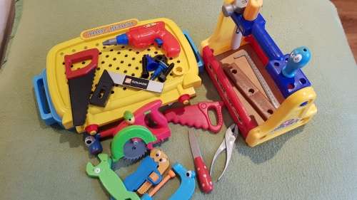 Kids Toy Tool bench in two parts with a variety of plastic tools and toolbox.