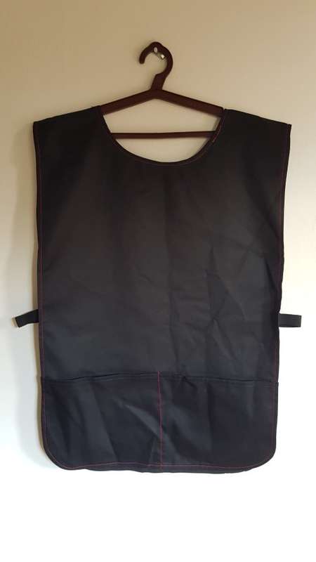Pinafore type double sided apron. Black