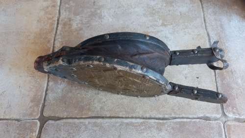 Antique Bellows. Wood covered in leather with round embossed brass plate