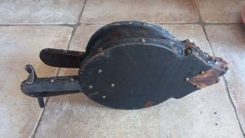 Antique Bellows. Wood covered in leather with round embossed brass plate