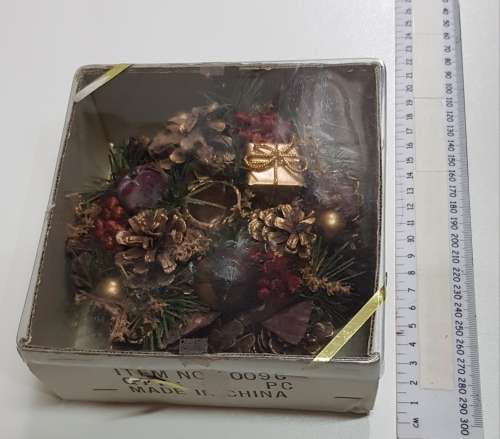 Vintage Christmas decoration. Candle holder wreath decorated with pine cones