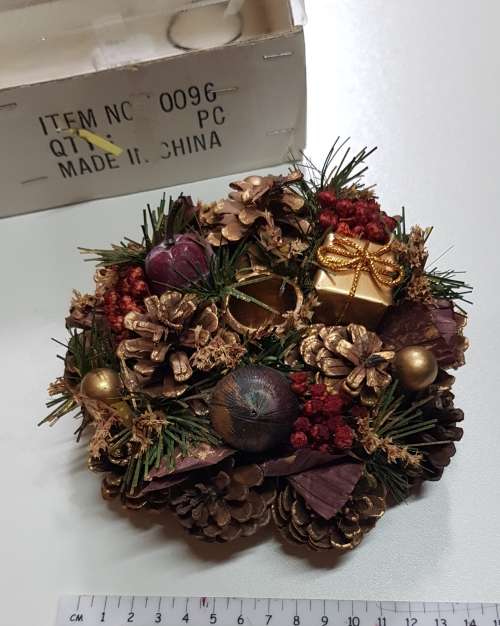 Vintage Christmas decoration. Candle holder wreath decorated with pine cones