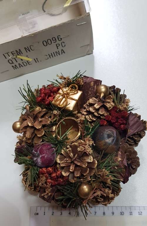 Vintage Christmas decoration. Candle holder wreath decorated with pine cones