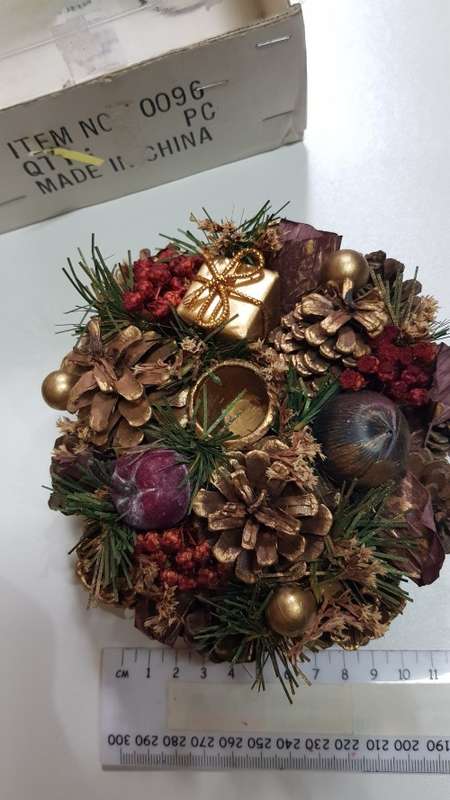 Vintage Christmas decoration. Candle holder wreath decorated with pine cones