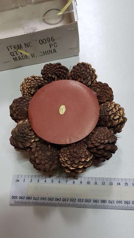 Vintage Christmas decoration. Candle holder wreath decorated with pine cones