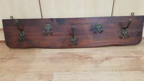 Wall mounted Coat Rack.  Hanging storage for Coats, clothes, and hats.