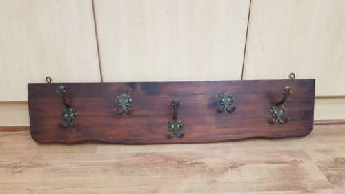 Wall mounted Coat Rack.  Hanging storage for Coats, clothes, and hats.