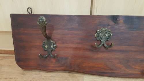 Wall mounted Coat Rack.  Hanging storage for Coats, clothes, and hats.