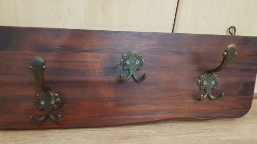 Wall mounted Coat Rack.  Hanging storage for Coats, clothes, and hats.