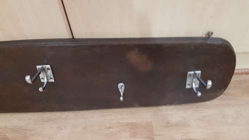 Vintage wall mounted Coat Rack.  Hanging storage for Coats, clothes, and hats.