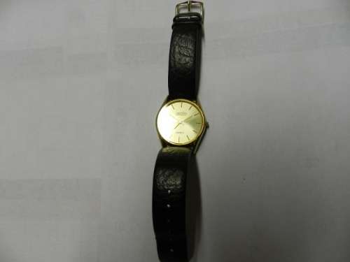 Vintage Mens watch / Astro Quartz.  c1970s.  Gold plated, round face with black leather strap.