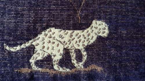Vintage Scatter cushion:  Leopards on Brown background, with a broad African print at the top.